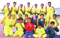 Winners show the victory sign after receiving medals at the concluding ceremony of Seventh National Sports for Blind, Guru Nanak Stadium, Ludhiana, on Saturday. 