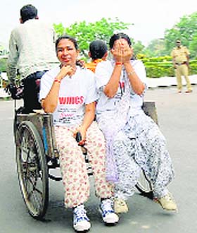 Women sit on a rehri in a relaxed mood during a 10-km long marathon organised by the Chirag Kala Academy in Panchkula on Sunday