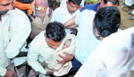 One-and-a-half-year-old Chhottu after being rescued from a borewell at Mochiwali village in Sirsa on Sunday.