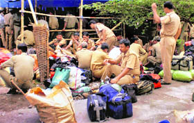 Security personnel prepare to go to various polling stations in Siliguri on Sunday.