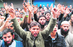 People shout slogans during a protest march against the killing of Jammu and Kashmir Jamiat-e- Ahli Hadees president Showkat Ahmad Shah in Srinagar on Sunday.