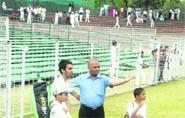 Parents, along with young cricketers, wait for their turn to play at the Sector 16 Cricket Stadium in Chandigarh