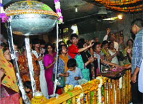 A replica of the Cricket World Cup trophy which is prepared with ladoos for the Bhog on the occasion of Hanuman Jayanti at Hanuman Temple in Delhi on Monday.