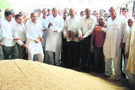 Prahlad Singh Gillankhera, CPS, reviews the procurement process at the grain market in Fatehabad.