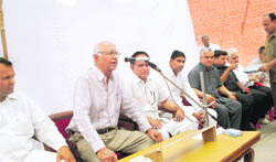Shamsher Sigh Surjewala, president, All-India Kisan Khet Majdoor Congress addresses a press conference in Kaithal.