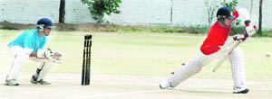 A batsman plays a defensive shot during the match between the Chandigarh Red and Chandigarh Blue teams in Sector 48, Chandigarh, on Tuesday.