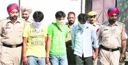 Snatchers in police custody in Ludhiana on Tuesday. 