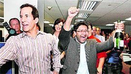 Los Angeles Times reporter Ruben Vives (right) celebrates with fellow reporter Jeff Gottlieb after they won the 2011 Pulitzer Prize for Public Service on Monday.