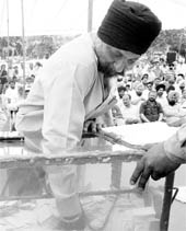 A man picks a slip during the Aerocity draw of lots at GMADA office in Mohali on Wednesday