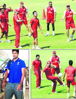 Players of Kings XI Punjab toil hard during a practice session ahead of the IPL tie with Rajasthan Royals in Chandigarh on Wednesday.  (left below) Pankaj Singh of Rajasthan Royals arrives at the Chandigarh Airport on Wednesday