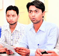 Anshul Chawla (right), president of the DAV ( PG) College Students Union, addresses a press conference in Dehradun on Wednesday