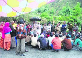 Environmentalists Kulbhushan Upmanyu and Rattan Chand apprise villagers on the aftermaths of a hydropower project