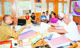 Anti-corruption NGO members during a meeting with the Mandi SP on Wednesday