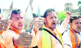 Activists of the Baba Amarnath and Baba Buda Amarnath Yatri Niyas hold a rally in Jammu on Wednesday