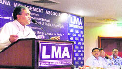 Chief general manager of the State Bank of India adresses members of the Ludhiana Management Association in Ludhiana