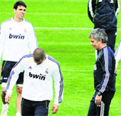 Real Madrid's coach Jose Mourinho (R) during a training session in Madrid on the eve of the Kings Cup final against Barcelona.