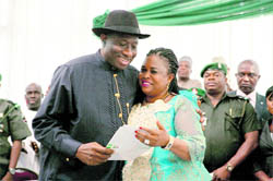 GOODLUCK SMILES: Newly-elected Nigerian President Goodluck Jonathan celebrates with his wife after receiving the certificate of victory in Abuja