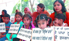 Children of the activists of the Unemployed Linemen Union join the protest, in Bathinda on Thursday.