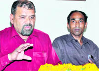 Trivendra Singh Panwar, president of the Uttarakhand Kranti Dal ( Panwar faction ), addresses a press conference at Haridwar 