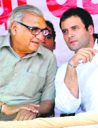 Chief Minister Bhupinder Singh Hooda is all ears as AICC general secretary Rahul Gandhi discusses a point with him at a convention of panchayat-level Youth Congress delegates in Gurgaon on Thursday