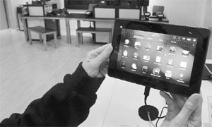 A customer holds a Research In Motions PlayBook tablet computer in Fairfax, Virginia, USA. Research In Motions PlayBook tablet computer launched in almost empty stores on Tuesday, unable to whip up the frenzy that accompanies the debut of anything from rival Apple.