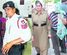 Head constable Om Parkash shows the mark on his left hand, which was bitten by a woman traffic offender; (right) a female constable takes the offender for a medical check-up at a local hospital following the incident.