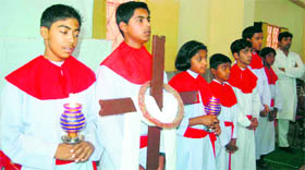 Children participate in a service on the occasion of Good Friday at St Francis Church in Dehradun.