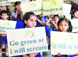Students of DAV Public School carry out an environment awareness rally on Earth Day in Ludhiana on Friday.