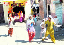 Muslim schoolgirls in a deserted street of Gadowali village after the panchayats diktat against girls working in factories in Haridwar on Friday