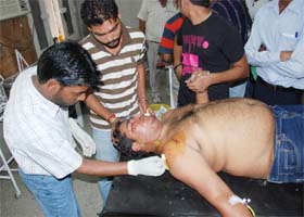 One of the two persons, injured in a firing incident that took place on the district court premises, undergoes treatment at the Civil Hospital in Bathinda on Friday