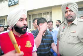 (From left) Councillor Prince Makkar and his accomplice AS Sachdeva outside the district courts in Jalandhar on Friday