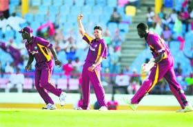 West Indies bowler Ravi Rampaul (C) celebrates after taking the wicket of Pakistans Umar Akmal during the Twenty20 international in St Lucia on Thursday