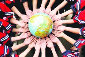 Students with a globe during a campaign to mark World Earth Day in Dexing, China. World Earth Day falls on April 22 every year