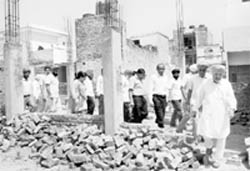 Residents of Dhakola village stall work at the construction site in Zirakpur on Saturday