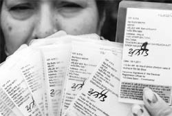 A resident of Bharat Enclave shows voter cards having wrong addresses in Zirakpur.