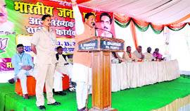 Uttarakhand Chief Minister Ramesh Pokhriyal Nishank addresses the national executive meeting of the minority cell of the BJP in Dehradun on Saturday.