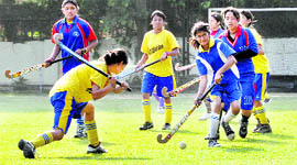 A match under way in the inter-school hockey tournament at Welham Girls School in Dehradun on Saturday. 