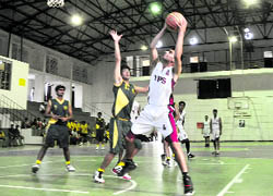 A match under way in the All-India Golden Jubilee Basketball Tournament at Welham Boys School in Dehradun on Saturday.