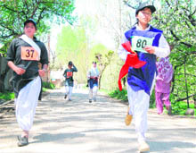 Girls take part in a marathon organised by the Army at Pulwama on Saturday