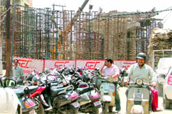 The ongoing construction at Lakkar Bridge is causing inconvenience to commuters