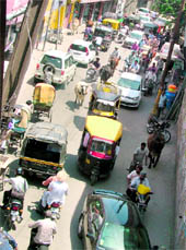 The Arya School road, the only way to reach Chaura Bazaar, remains clogged due to the ongoing construction work on the Lakkar Bridge in Ludhiana