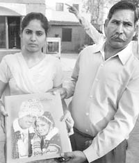 Monika, along with her father, shows her marriage album