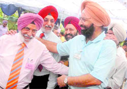 Rival presidential candidates, Raja Malvinder Singh and Lt-Col JS Panag, are all smiles as they shake hands during the Chandigarh Golf Club elections on Sunday