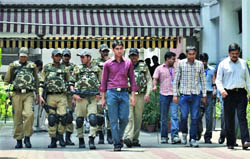 Members of the Special Weapons and Tactics (SWAT) team and a bomb squad inspect the Nirvachan Sadan in New Delhi on Sunday.