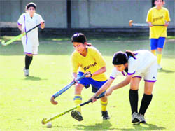 Players in action at a match in the Welhams Invitational School Hockey Tournament in Dehradun on Sunday