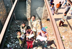 Children show drugs dumped inside the roofless rooms of Government School at Islam Ganj in Ludhiana