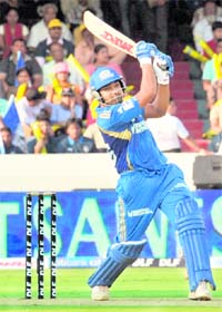Mumbai Indians Rohit Sharma hits a six during his innings of 56 runs against Deccan Chargers in Hyderabad on Sunday. Mumbai Indians won by 37 runs