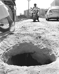 An uncovered manhole is an open invitaion to death at Himmatgarh Dhakola, Zirakpur. 