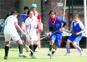 Players in action in the Welhams Invitational School Hockey Tournament in Dehradun on Monday.