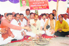 Raghunath Singh Negi, vice-president of the Garhwal Mandal Vikas Nigam holds a yajna in Dehradun on Monday.